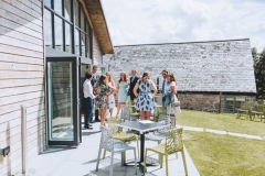 The Green Rom Bar with guests mingling on the terrace